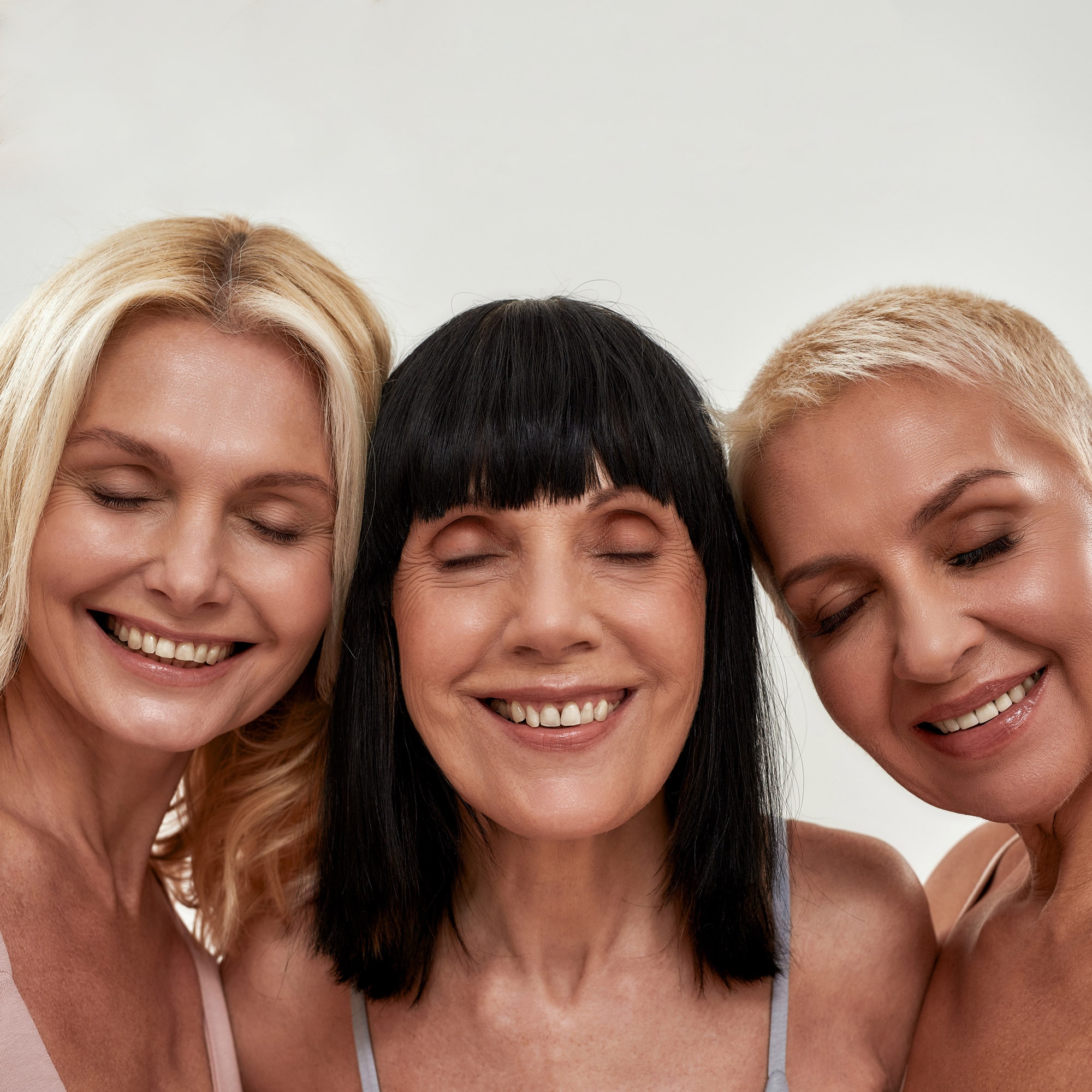 Three women enjoy smooth, clear skin, free from sunspots, age spots and pigmentation after treatments with Lumecca